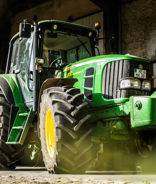 Agricultural tractor in a machinery shed