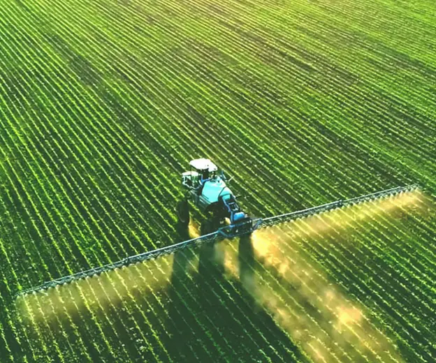 Self-propelled sprayer working a field
